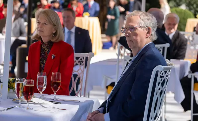 Sen. Mitch McConnell, R-Ky., and Sen. Lisa Murkowski, R-Alaska, join a lunch hosted by President Donald Trump, on the Rose Garden patio at the White House, Tuesday, Oct. 21, 2025, in Washington. (AP Photo/Manuel Balce Ceneta)