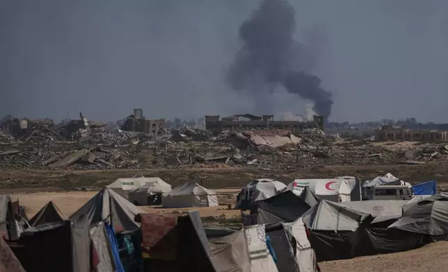 Smoke rises to the sky following an Israeli military strike in Gaza City, as seen from the central Gaza Strip, Thursday, Oct. 2, 2025. (AP Photo/Abdel Kareem Hana)