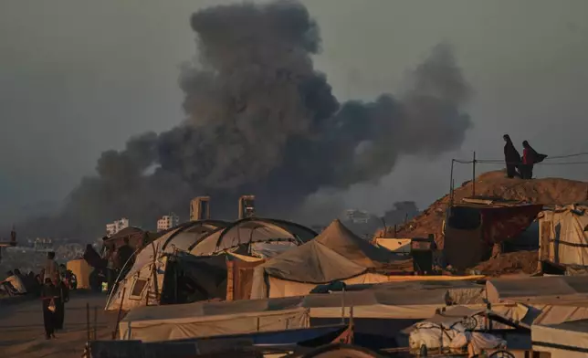 Smoke rises following an Israeli military strike in Gaza City, as seen from the central Gaza Strip, Wednesday, Oct, 1, 2025. (AP Photo/Abdel Kareem Hana)