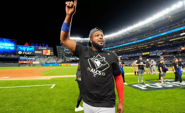 Toronto Blue Jays first baseman Vladimir Guerrero Jr. celebrates after the Blue Jays beat the New York Yankees in Game 4 of baseball's American League Division Series, Wednesday, Oct. 8, 2025, in New York. (AP Photo/Yuki Iwamura)