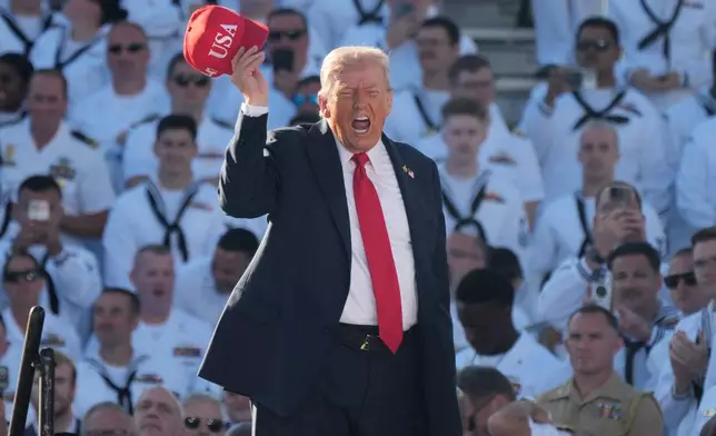 President Donald Trump arrives to speak during a celebration for the 250th anniversary of the U.S. Navy aboard the USS Harry S. Truman at Naval Station Norfolk, Sunday Oct. 5, 2025 in Norfolk, Va. (AP Photo/Steve Helber)