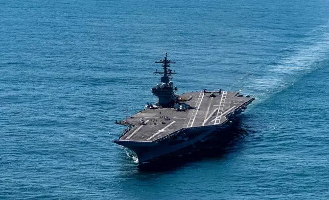 The USS George H.W. Bush aircraft carrier sails in the Atlantic Ocean off the coast of Norfolk, Va., Saturday, Oct. 4, 2025. (AP Photo/Alex Brandon, Pool)