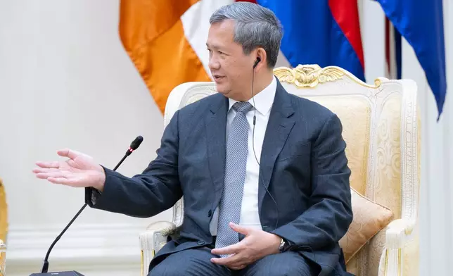 In this photo released by Agence Kampuchea Press (AKP), Cambodian Prime Minister Hun Manet talks with South Korea's Vice Foreign Minister Kim Jina, during a meeting in Phnom Penh, Cambodia, Thursday, Oct. 16, 2025. (AKP via AP)