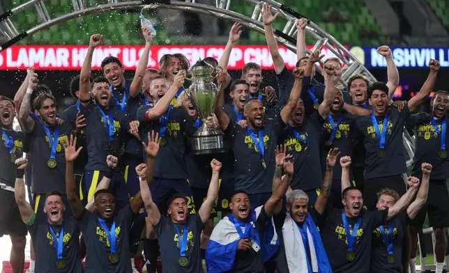 Nashville SC players celebrate their win over Austin FC in an U.S. Open Cup final soccer match in Austin, Texas, Wednesday, Oct. 1, 2025. (AP Photo/Eric Gay)