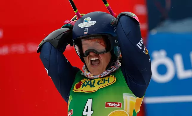United States' Paula Moltzan celebrates at the finish area of an alpine ski, women's World Cup giant slalom, in Soelden, Austria, Saturday, Oct. 25, 2025. (AP Photo/Alessandro Trovati)