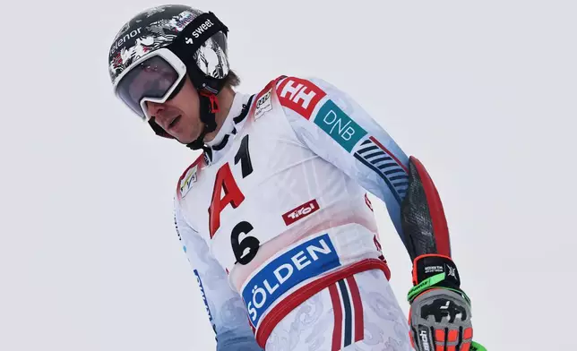 Norway's Henrik Kristoffersen reacts at the finish area of an alpine ski, men's World Cup giant slalom, in Soelden, Austria, Sunday, Oct. 26, 2025. (AP Photo/Marco Trovati)