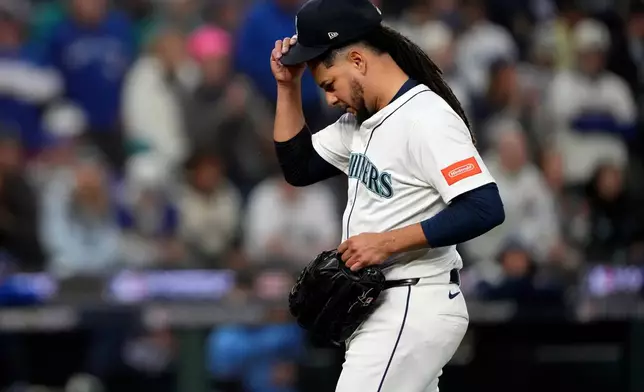 Seattle Mariners pitcher Luis Castillo leaves the game during the third inning in Game 4 of baseball's American League Championship Series against the Toronto Blue Jays, Thursday, Oct. 16, 2025, in Seattle. (AP Photo/Lindsey Wasson)