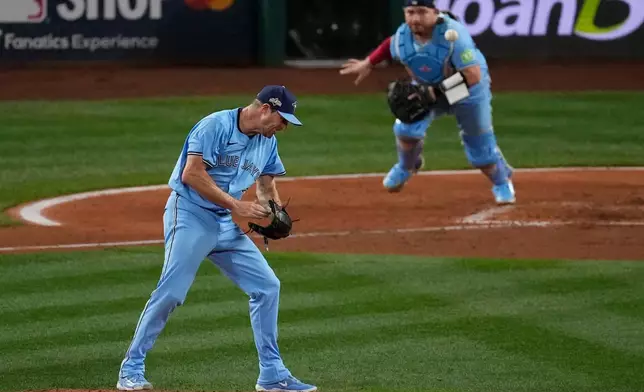 Toronto Blue Jays pitcher Max Scherzer reacts to a strike out against the Toronto Blue Jays during the fifth inning in Game 4 of baseball's American League Championship Series, Thursday, Oct. 16, 2025, in Seattle. (AP Photo/David J. Phillip)