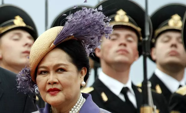 FILE - Queen Mother Sirikit passes by Russian honor guards while arriving in Moscow Vnukovo airport, July 2, 2007. (AP Photo/Misha Japaridze, File)