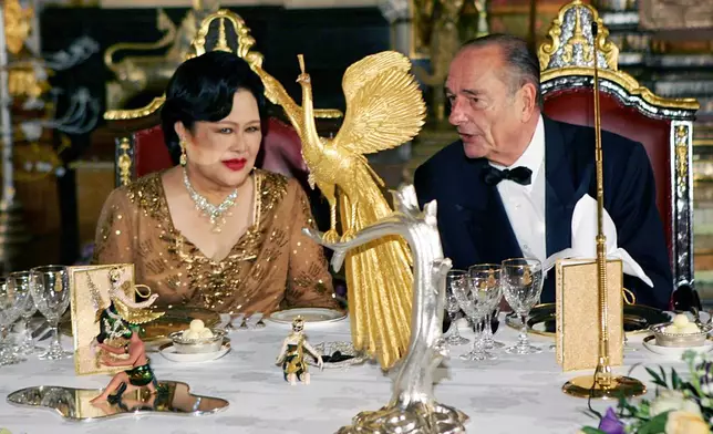 FILE - French President Jacques Chirac, right, speaks with Queen Sirikit of Thailand, at the start of a gala dinner given at the Royal Palace on the first day of his three-day official visit in Bangkok, Thailand, Friday Feb. 17, 2006. (AP Photo/Remy de la Mauviniere, Pool, File)