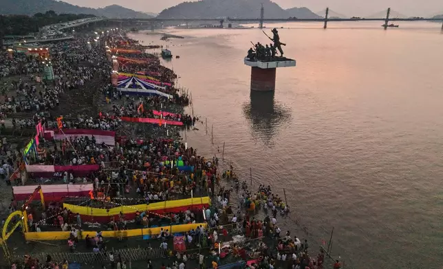 Indian Hindu devotees perform rituals in the the river Brahmaputra during the Chhath Puja festival in Guwahati, India, Monday, Oct. 27, 2025. (AP Photo/Anupam Nath)
