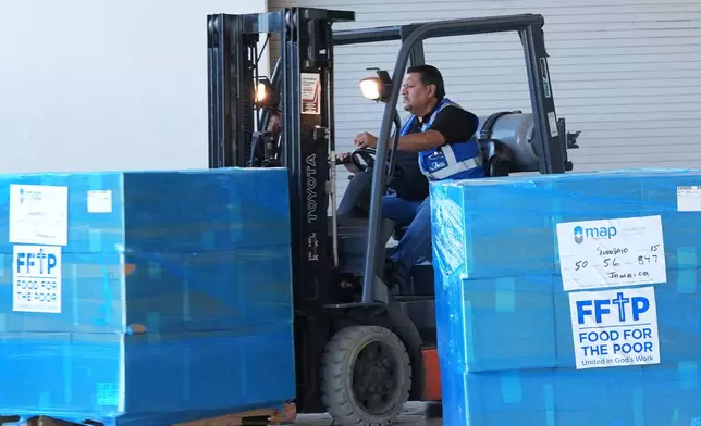 Emergency supplies are loaded on a semi truck bound for Jamaica, Thursday, Oct. 30, 2025, at Food for the Poor in Coconut Creek, Fla. (AP Photo/Marta Lavandier)
