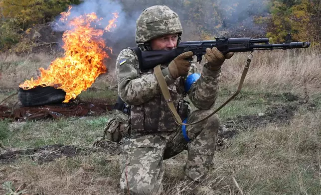 In this photo provided by Ukraine's 65th Mechanized Brigade press service, recruits attend drills at a training ground in the Zaporizhzhia region, Ukraine, Saturday, Oct. 11, 2025. (Andriy Andriyenko/Ukraine's 65th Mechanized Brigade via AP)