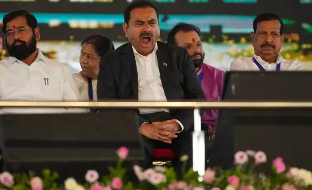 Chairman Adani Group, Gautam Adani yawns during the inauguration ceremony of the Navi Mumbai International Airport in Navi Mumbai, India, Wednesday, Oct. 8, 2025. (AP Photo/Rafiq Maqbool)
