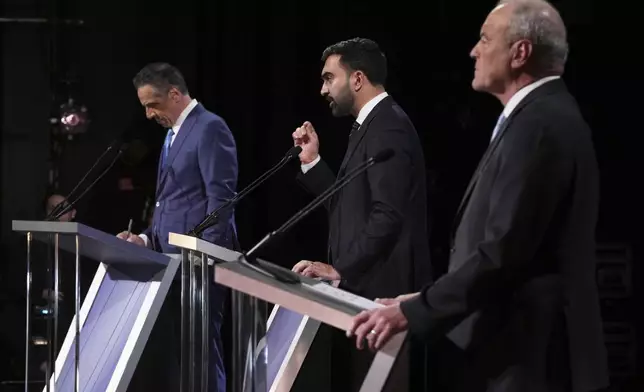 Independent candidate former New York Gov. Andrew Cuomo, Republican candidate Curtis Sliwa and Democratic candidate Assemblyman Zohran Mamdani participate in a second New York City mayoral debate at LaGuardia Performing Arts Center at LaGuardia Community College in the Queens borough of New York, Wednesday, Oct. 22, 2025. (Hiroko Masuike/The New York Times via AP, Pool)