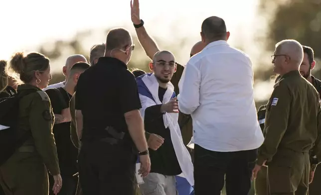 Rom Breslavski, an Israeli hostage released from the Gaza Strip walks off a helicopter at the Sheba Medical Center in Ramat Gan, Israel, Monday, Oct. 13, 2025. (AP Photo/Leo Correa)
