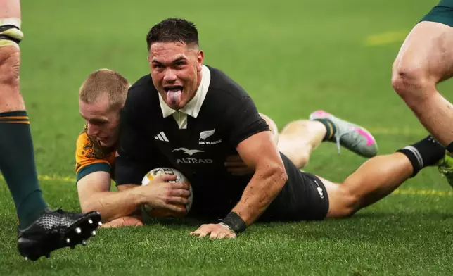 New Zealand's Quinn Tupaea reacts after scoring a try during the Bledisloe Cup rugby test between the All Blacks and the Wallabies in Perth, Australia, Saturday, Oct 4, 2025. (AP Photo/Gary Day)