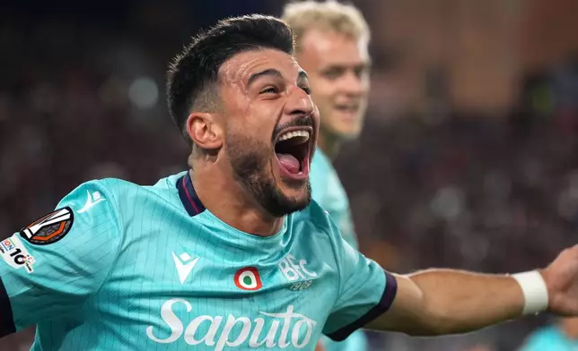 Bologna's Riccardo Orsolini celebrates after scoring his side's opening goal during the Europa League, opening phase soccer match between Bologna and Freiburg at the Renato Dall'Ara Stadium in Bologna, Italy, Thursday, Oct. 2, 2025. (Massimo Paolone/LaPresse via AP)