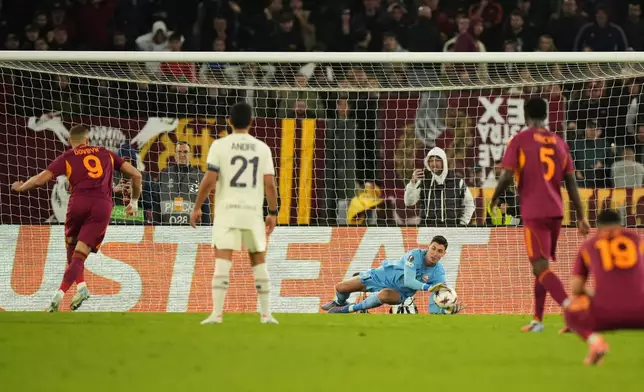 Lille goalkeeper Mile Svilar saves a penalty kicked by Roma's Artem Dovbyk during the Europa League Europa League soccer match between AS Roma and Lille at the Olympic stadium in Rome, Thursday, Oct. 2, 2025. (AP Photo/Andrew Medichini)