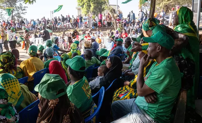 Supporters of Tanzanian presidential candidate Samia Suluhu Hassan, of the ruling Chama Cha Mapinduzi party, listen to speeches during a campaign rally in Arusha, Tanzania, Oct. 11, 2025. (AP Photo)