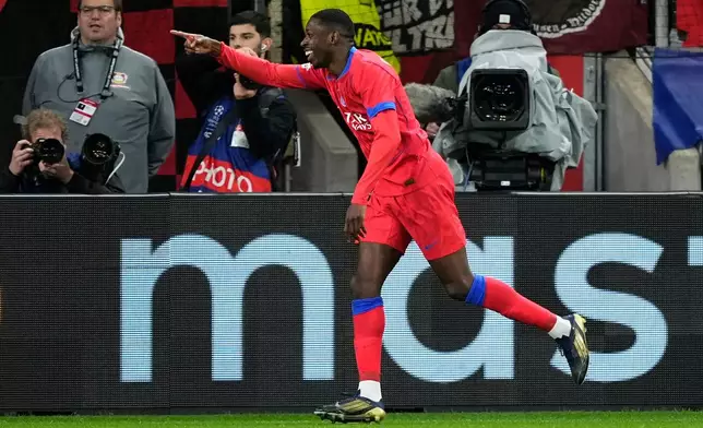 PSG's Ousmane Dembele celebrates after scoring his side's sixth goal during a Champions League opening phase soccer match between Bayer Leverkusen and Paris Saint-Germain in Leverkusen, Germany, Tuesday, Oct. 21, 2025. (AP Photo/Martin Meissner)