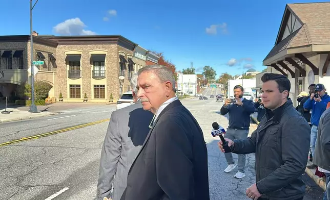Former Spartanburg County Sheriff Chuck Wright walks out of court after pleading guilty to theft and conspiracy charges on Thursday, Oct. 30, 2025, in Anderson, S.C. (AP Photo/Jeffrey Collins)