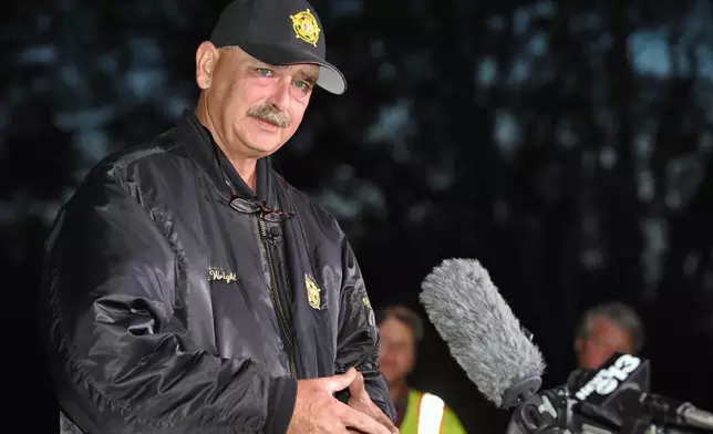 FILE - Spartanburg County Sheriff Chuck Wright speaks during a news conference in front of Todd Kohlhepp's property in Woodruff, S.C., Nov. 6, 2016. (AP Photo/Richard Shiro, File)