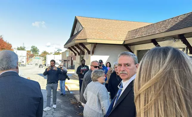 Former Spartanburg County Sheriff Chuck Wright walks out of court after pleading guilty to theft and conspiracy charges on Thursday, Oct. 30, 2025, in Anderson, S.C. (AP Photo/Jeffrey Collins)