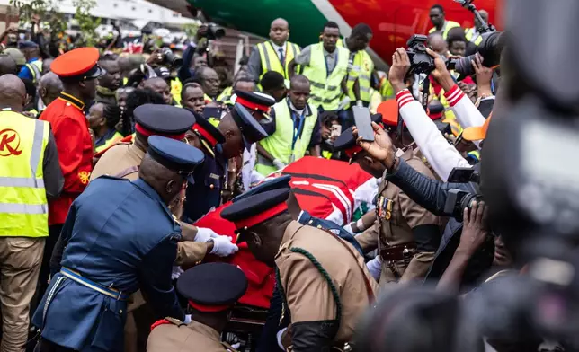 The body of Kenya's former Prime Minister Raila Odinga arrives in Nairobi, Kenya, a day after he died in India, Thursday, Oct. 16, 2025. (AP Photo/Samson Otieno)
