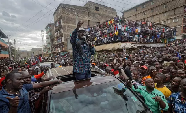 Kenyan opposition leader Raila Odinga gestures to thousands of supporters gathered in the Mathare slum of Nairobi, Kenya, Sunday, Aug. 13, 2017. (AP Photo/Ben Curtis)