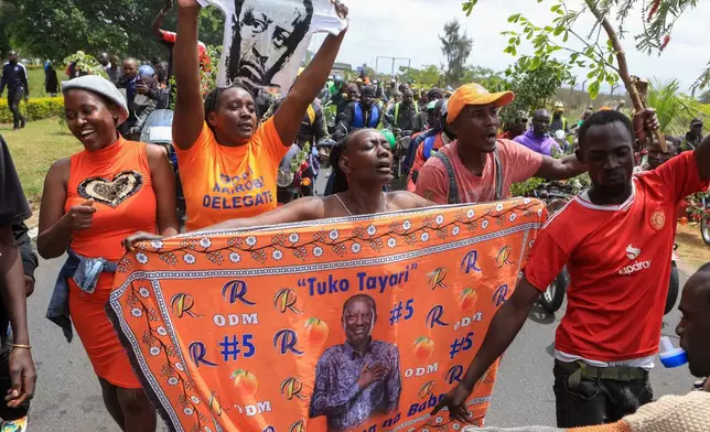Supporters of Kenya's former Prime Minister Raila Odinga escort his body after arriving in Nairobi, Kenya, Thursday, Oct. 16, 2025. Odinga died Wednesday in India at the age of 80. (AP Photo/Andrew Kasuku)