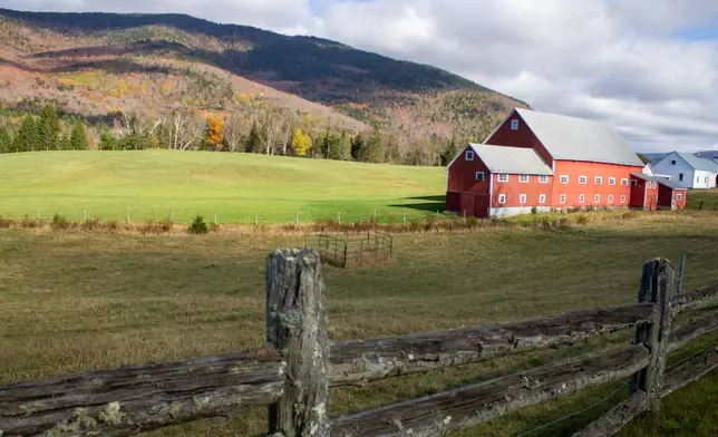 Clouds cast shadows on the mountains behind the Pioneer Farm, also known as the Wallace Farm, in Columbia, N.H., on Thursday, Oct. 9, 2025. (AP Photo/Holly Ramer)