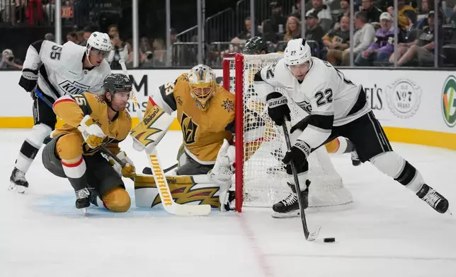 Los Angeles Kings left wing Kevin Fiala (22) looks to pass against the Vegas Golden Knights during the first period of an NHL hockey game Wednesday, Oct. 8, 2025, in Las Vegas. (AP Photo/John Locher)