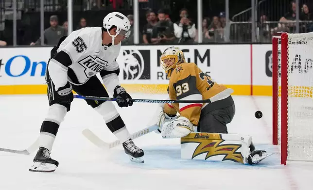 Los Angeles Kings right wing Quinton Byfield (55) scores against Vegas Golden Knights goaltender Adin Hill (33) during the first period of an NHL hockey game Wednesday, Oct. 8, 2025, in Las Vegas. (AP Photo/John Locher)