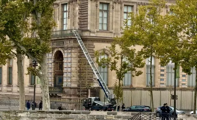 A basket lift used by thieves is seen at the Louvre museum Sunday Oct.19, 2025 in Paris. (AP Photo/Alexander Turnbull)