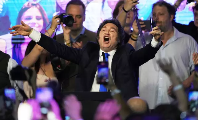 Argentina's President Javier Milei celebrates after winning in legislative midterm elections in Buenos Aires, Argentina, Sunday, Oct. 26, 2025. (AP Photo/Rodrigo Abd)