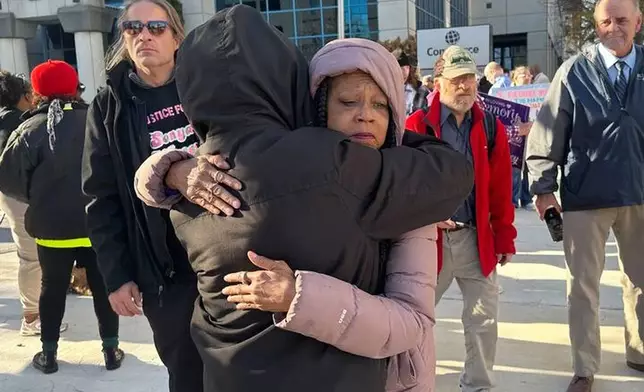 Sonya Massey’s mother, Donna Massey, hugs a supporter outside the Peoria County Courthouse in Peoria, Ill., Wednesday, October 29, 2025. (AP Photo/John O’Connor)