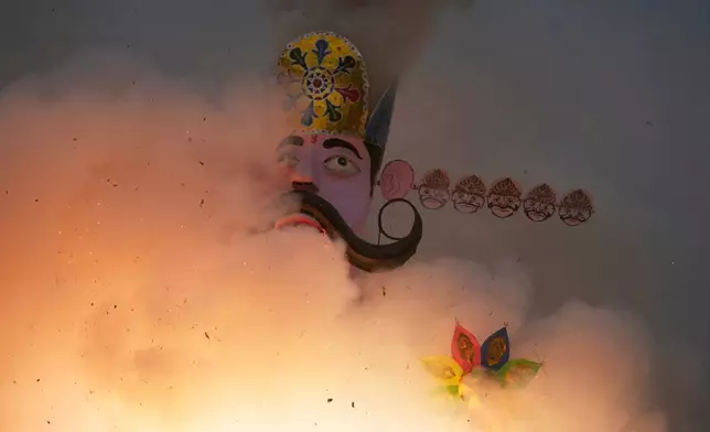 An effigy of mythical demon king Ravana goes up in flames marking the end of Dussehra festival in Jammu, India, Thursday, Oct.2, 2025.(AP Photo/Channi Anand)