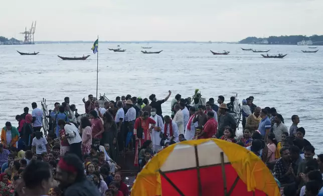 Myanmar Hindu devotees take part in the last day of the 'Durga Puja' festival in Yangon, Myanmar, Thursday, Oct. 2, 2025. (AP Photo/Thein Zaw)