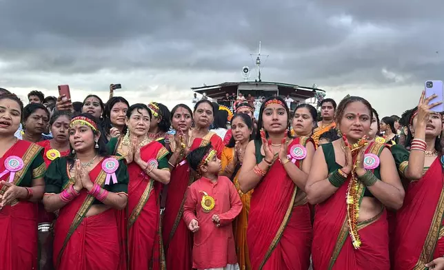 Myanmar Hindu devotees take part in the last day of the 'Durga Puja' festival in Yangon, Myanmar, Thursday, October. 2, 2025. (AP Photo/Thein Zaw)