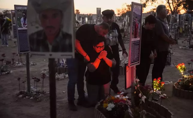 People visit the site of the Nova music festival, where hundreds of revelers were killed and abducted by Hamas and taken into Gaza, as Israel marks the second year anniversary of the attack, near Kibbutz Reim, southern Israel, Tuesday, Oct. 7, 2025. (AP Photo/Ariel Schalit)