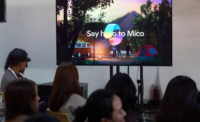 A video animation shows a Copilot Appearance avatar called Mico, floating around an abstract environment during a presentation at Microsoft's Fall 2025 Copilot Sessions event on Wednesday, Oct. 22, 2025, in Los Angeles. (AP Photo/Damian Dovarganes)