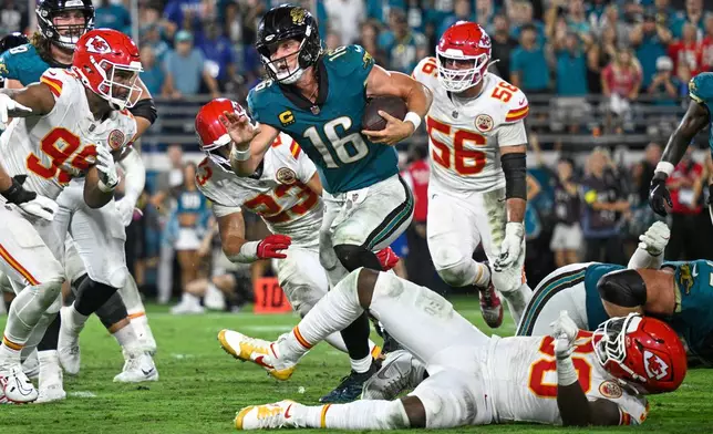 Jacksonville Jaguars quarterback Trevor Lawrence (16) runs for a touchdown during the second half of an NFL football game against the Kansas City Chiefs, Monday, Oct. 6, 2025, in Jacksonville, Fla. (AP Photo/Phelan M. Ebenhack)