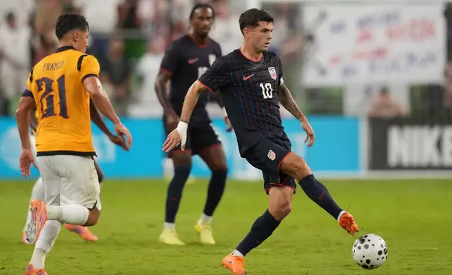 United States Christian Pulisic (10) moves the ball past Ecuador midfielder Alan Franco (21) during the second half of an international friendly soccer match in Austin, Texas, Friday, Oct. 10, 2025. (AP Photo/Eric Gay)