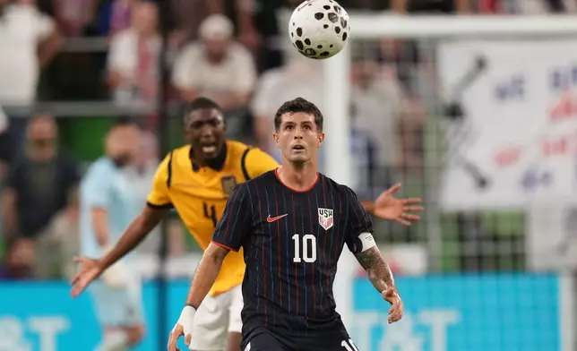 United States Christian Pulisic (10) looks for a pass in front of Ecuador defender Joel Ordonez (4) during the second half of an international friendly soccer match in Austin, Texas, Friday, Oct. 10, 2025. (AP Photo/Eric Gay)