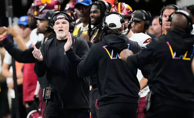 Washington Commanders head coach Dan Quinn reacts during the first half of an NFL football game against the Atlanta Falcons, Sunday, Sept. 28, 2025, in Atlanta. (AP Photo/Brynn Anderson)