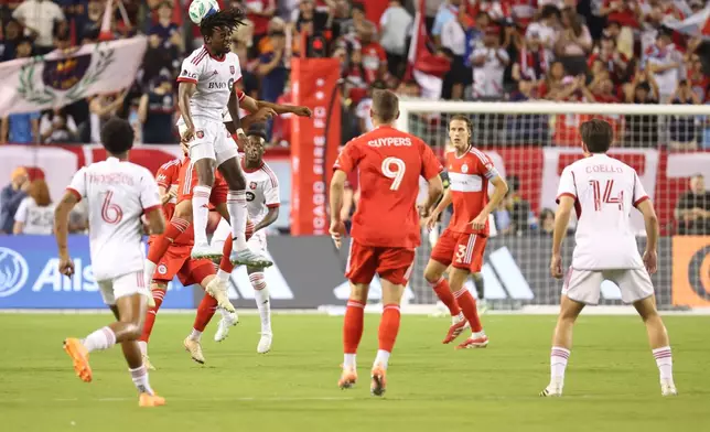 Toronto FC forward Deandre Kerr, top left, heads the ball during the first half of an MLS soccer match against the Chicago Fire, Saturday, Oct. 4, 2025, in Chicago. (AP Photo/Talia Sprague)