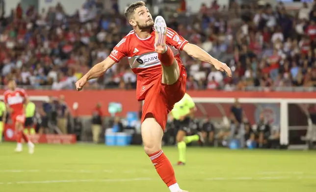 Chicago Fire forward Hugo Cuypers kicks the ball in bounds during the first half of an MLS soccer match against Toronto FC, Saturday, Oct. 4, 2025, in Chicago. (AP Photo/Talia Sprague)