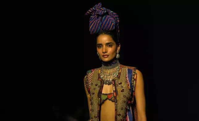 A model presents creation by AseemKapoor during the Lakmé Fashion Week in partnership with Fashion Design Council of India or FDCI in New Delhi, India, Thursday, Oct. 9, 2025. (AP Photo/Manish Swarup)