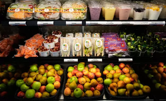 A selection of produce from California farmers and other food offered on the Belvedere Middle School menu is displayed before a news conference with Gov. Gavin Newsom, Wednesday, Oct. 8, 2025, in Los Angeles. (AP Photo/Damian Dovarganes)